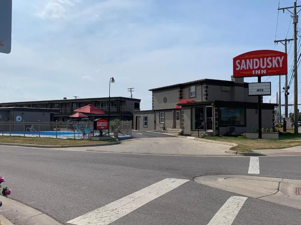 Sandusky Inn office, sign, and pool seen from Milan Road